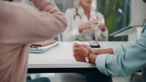 doctor comforting a patient in their office