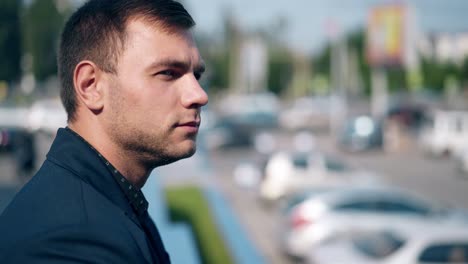 close view handsome man in blue suit and black shirt