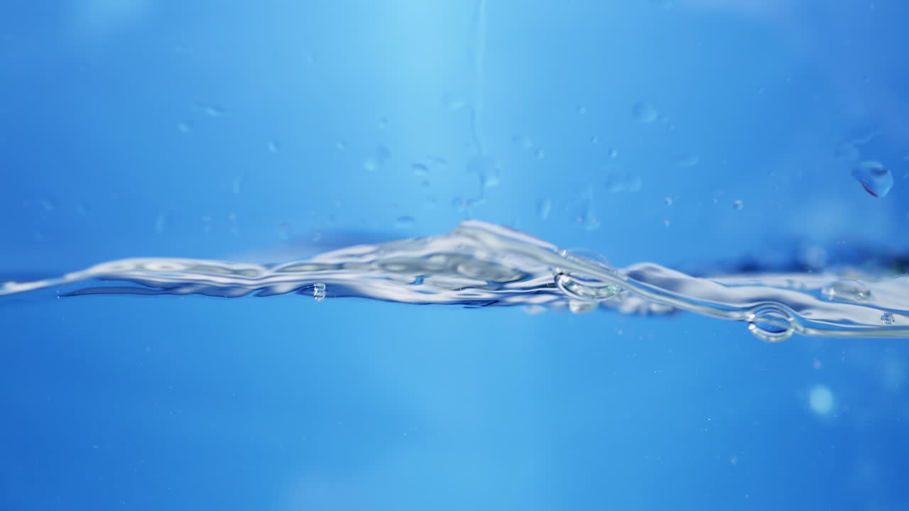 Crystal Clear Ripple Effect: Stunning Macro View of Water Droplets Creating Smooth Waves