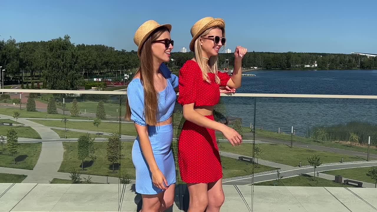 Two stylish women enjoying summer day outdoors