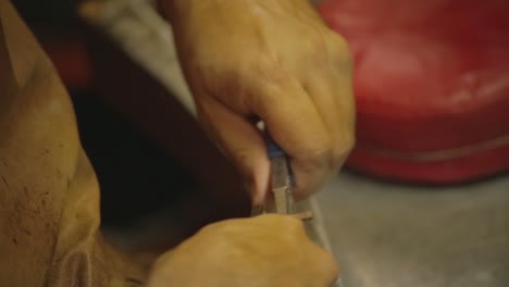 italian goldsmith at work building an engagement or a wedding ring