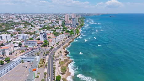 Aerial-drone-view-along-George-Washington-avenue-pier-and-cityscape,-Santo-Domingo,-Dominican-Republic