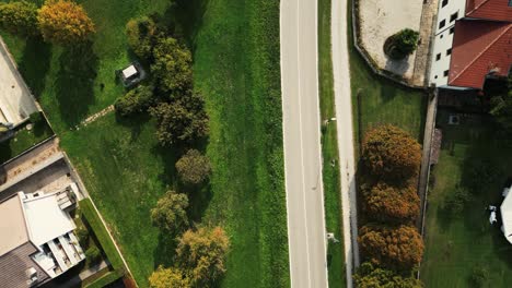 A-cinematic-drone-shot-of-a-black-Ferrari-running-on-an-italian-street