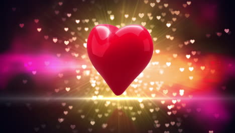 red heart turning on glittering background