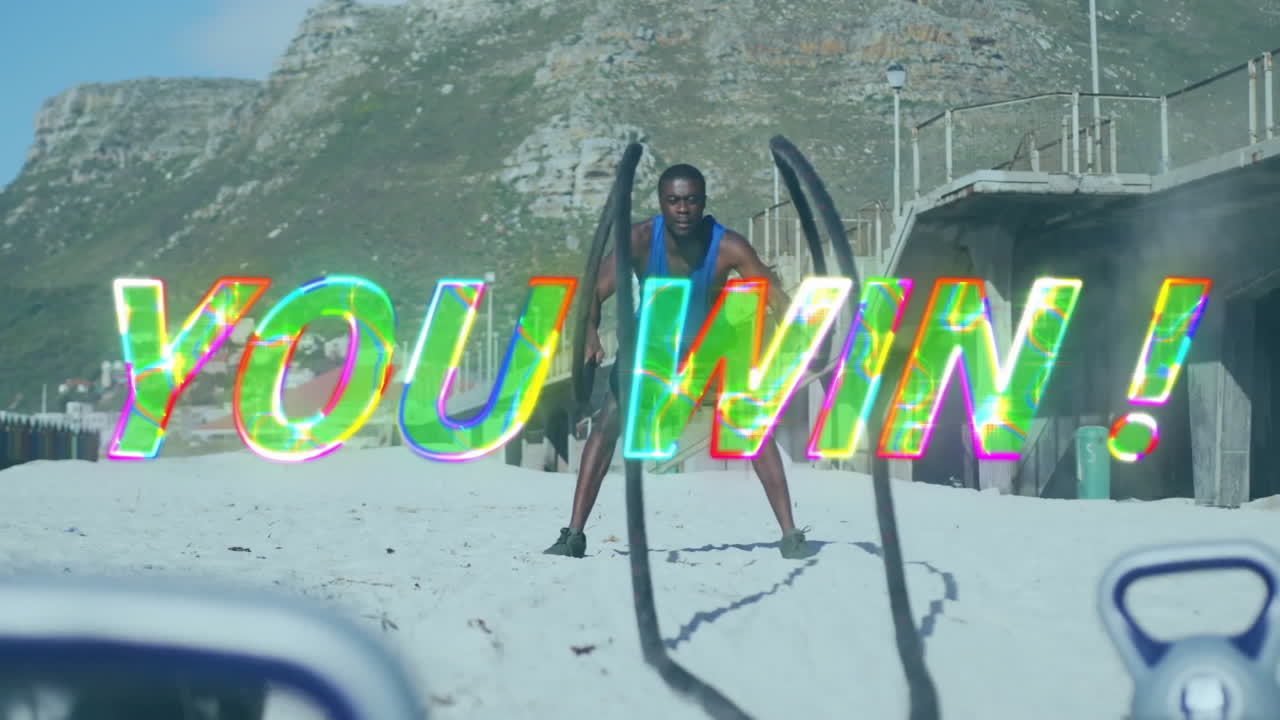 당신은 승리! 해변에서 전투 로프로 운동하는 남자에 대한 텍스트 애니메이션