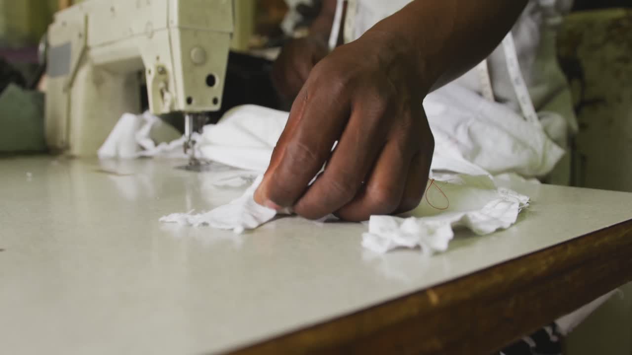 African man cutting tissue