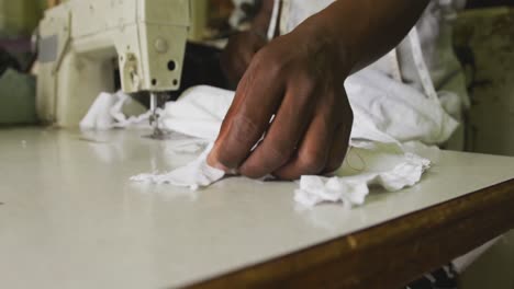 African-man-cutting-tissue