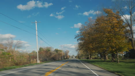 Driving-in-a-typical-American-suburb,-view-from-the-driver's-side