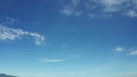 a loop of clouds in the sunny skies