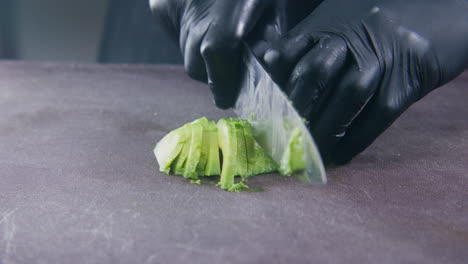 male cook cuts avocado for toast or salad