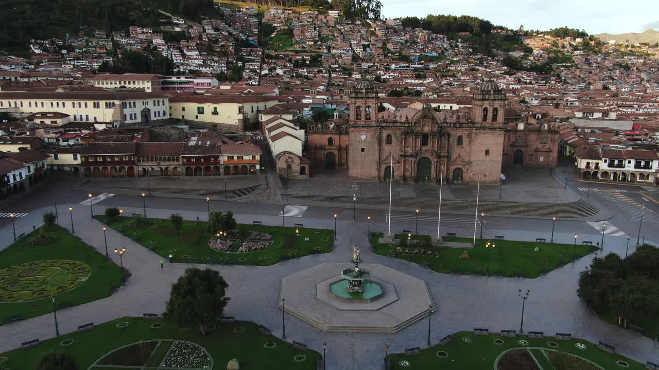 4k aerial footage at twilight of Plaza de Armas in Cusco City, Peru during Coronavirus quarantine, left to right truck and pan, wide angle shot