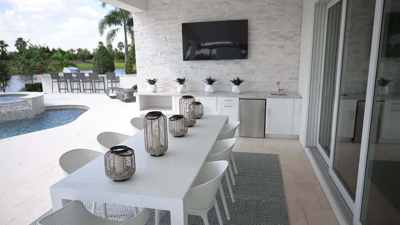 gorgeous outdoor design pool and family play area, white sleek outdoor space for family entertaining