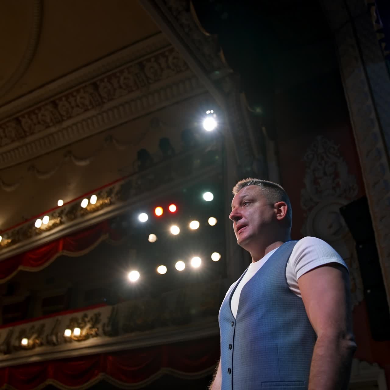 Actor in medical mask on theatre scene. Motivational Speaker