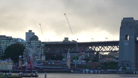 a train passes by luna park in the early morning, australia