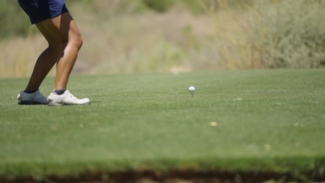 slow motion driver golf swing, tee flipping through the air