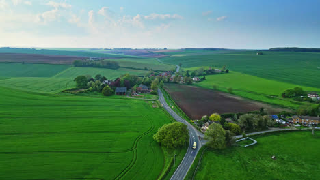 Aerial-drone-footage-illustrates-Burwell-village,-once-medieval-market-town—surrounding-fields,-traditional-red-brick-houses,-and-the-unused-Saint-Michael-parish-church-on-Lincolnshire's-Wold-Hills