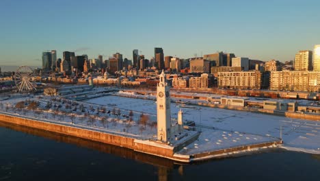 Stunning aerial view of Montreal’s old port with the clock tower and city skyline in winter, North America, Quebec, Montreal, Canada.