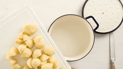 preparing classic mashed potatoes for thanksgiving dinner.