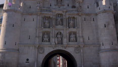 arco santa maria city gate in burgos, spain, wide shot tilt down
