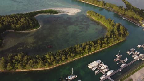 tilt up drone shot of yacht port and fishing bay at american memorial park, saipan