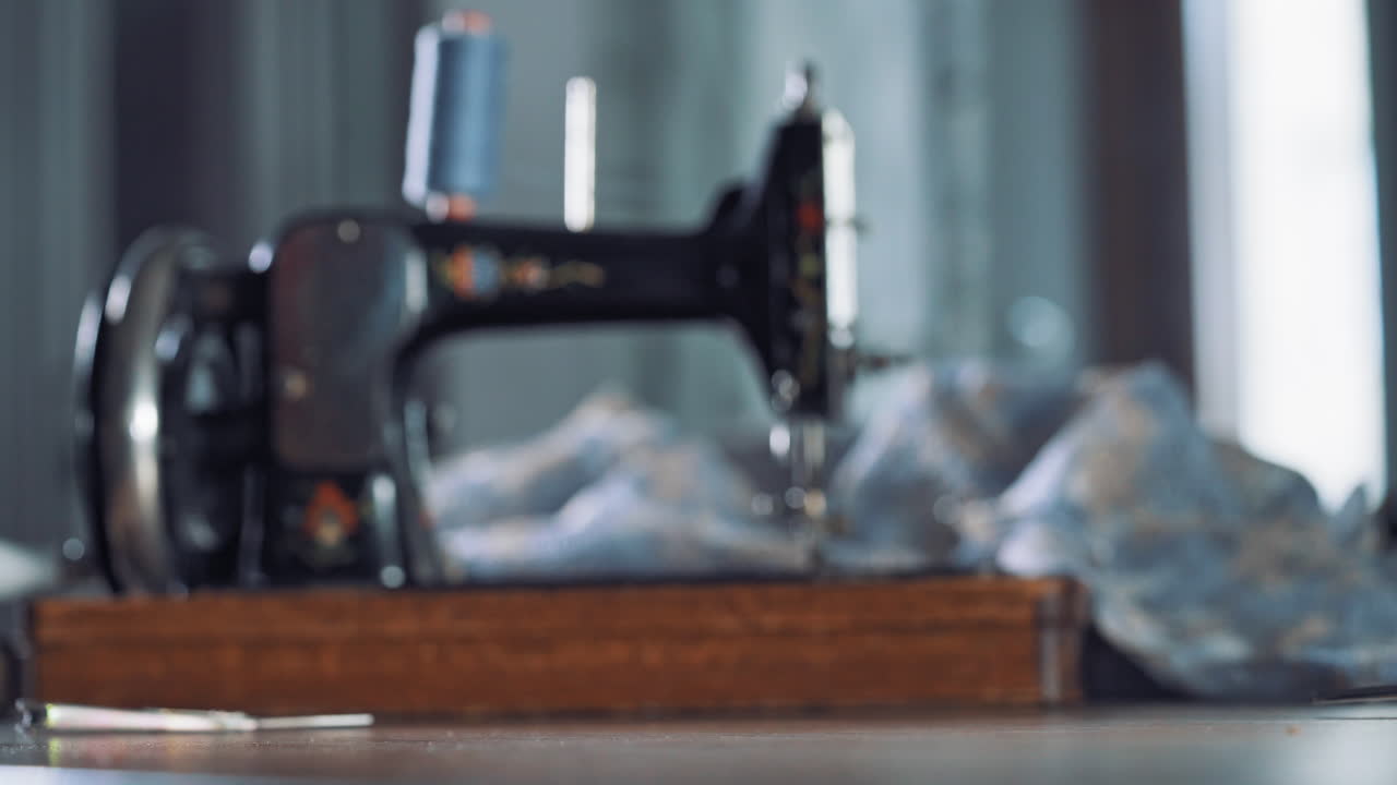 Measurement line on table. Close up view of woman hand rolled up measuring tape