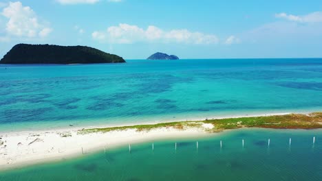 tropical islands, uninhabited cays with palm forest in the tropical waters