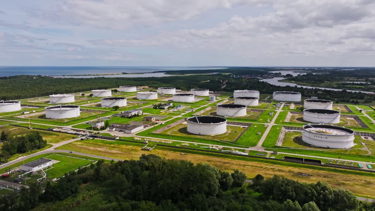 Industrial oil storage landscape in Gdańsk near Baltic Sea, global conflict