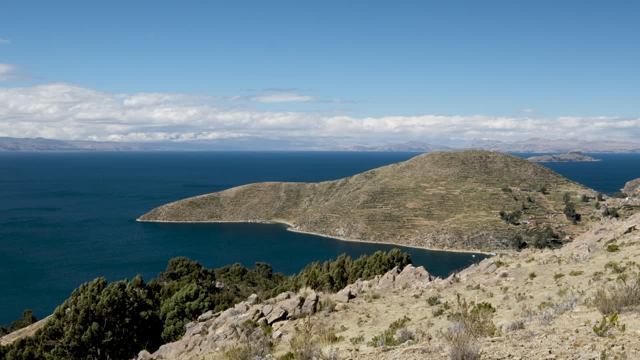 Experience the incredible panoramic views from Isla del Sol in Copacabana, Bolivia. The vast expanse of Lake Titicaca, pristine landscapes, and the stunning natural beauty of this sacred island