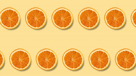 animación de bucle sin costuras con dos filas de rebanadas de naranja en un fondo amarillo pastel, espacio de copia