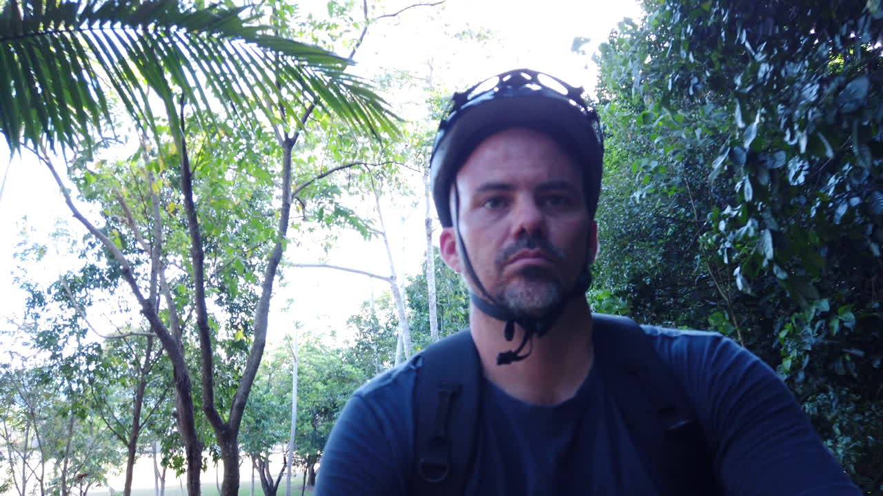 guy riding a bike on a bike path close up slow motion  a