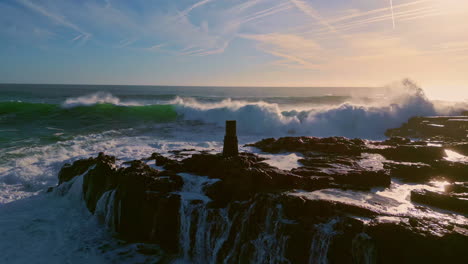 foaming sea breaking stones slow motion. aerial view stormy ocean crashing rocks