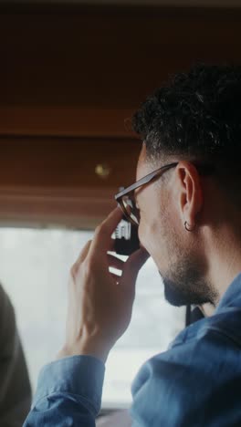 man taking photo inside camper van