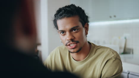 guy talking friend at relaxed meeting home closeup. mustache man speaking