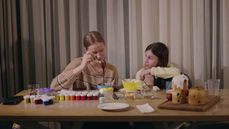 sisters decorating easter bread