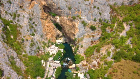 aerial view of dervish house and vrelo bune on buna river in blagaj, bosnia and herzegovina