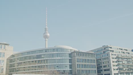 static establisher minimal shot of tv tower of berlin with buildings, clear sky