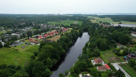 aerial view of morruman river running through swedish village morrum