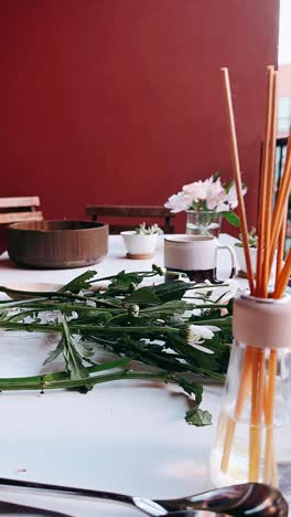 cozy home workspace with flowers and diffuser