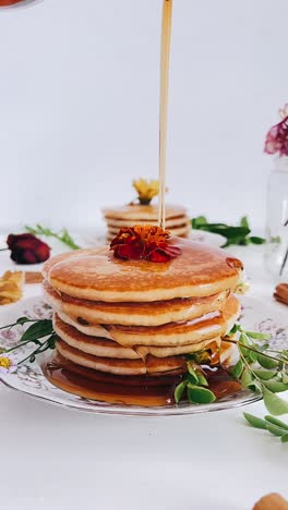 fluffy pancakes drizzled with maple syrup