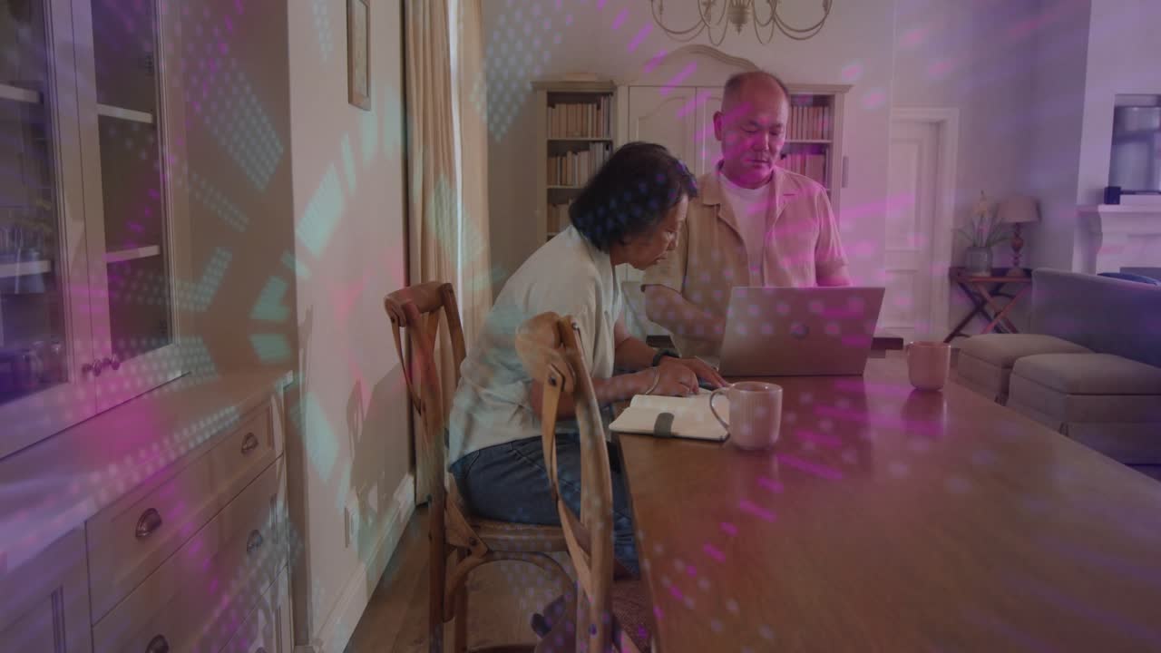 Woman leaning, writing notebook while man pointing, laptop drawing focus, overlay moving, budgeting