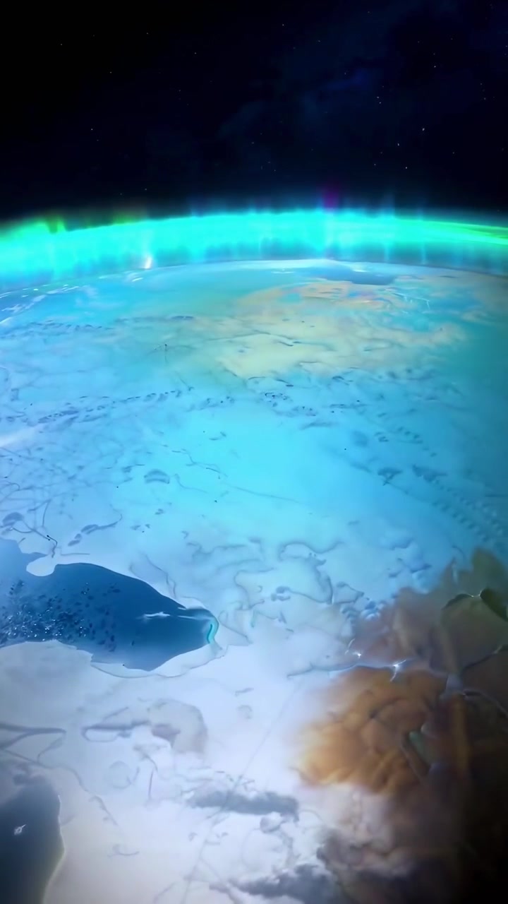 Planet Earth Rotating from Night to Day with Aurora Borealis
