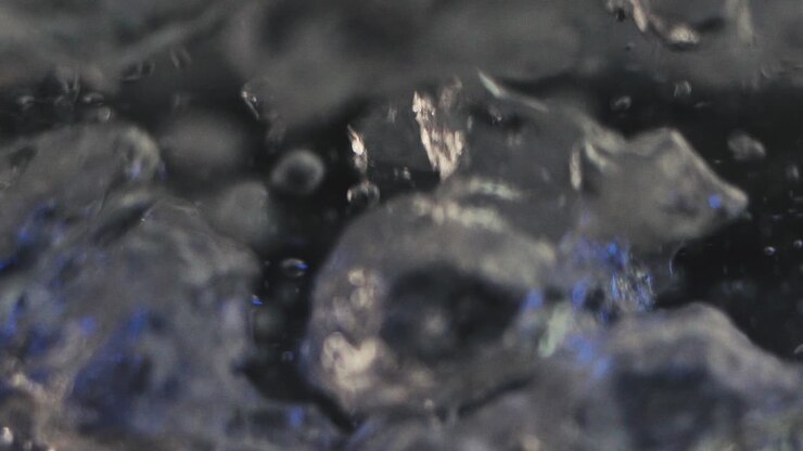 The water in the kettle heats up and bubbles