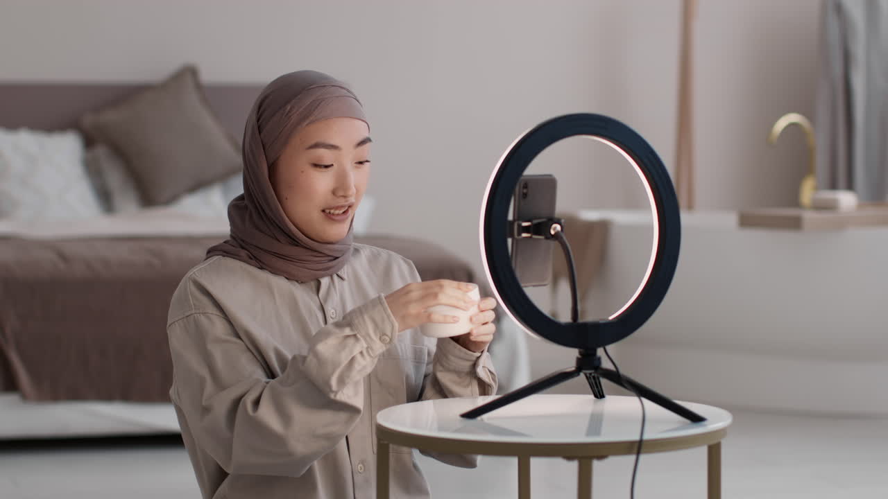 Woman reviewing skincare product via vlog on social media