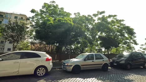 cars parked along a graffiti-covered street