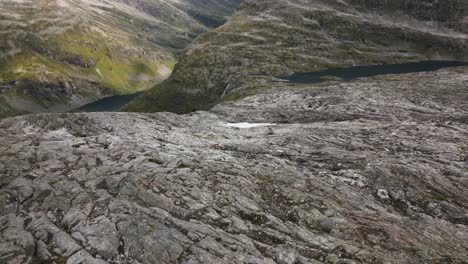 beautiful mountain landscape with a light snow cover and several lakes, norway, europe, drone