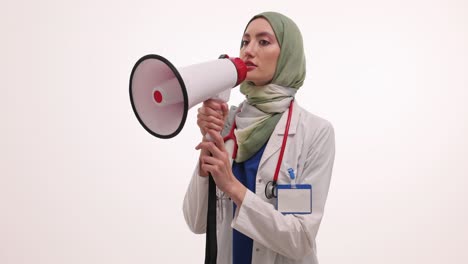 Muslim female doctor with megaphone