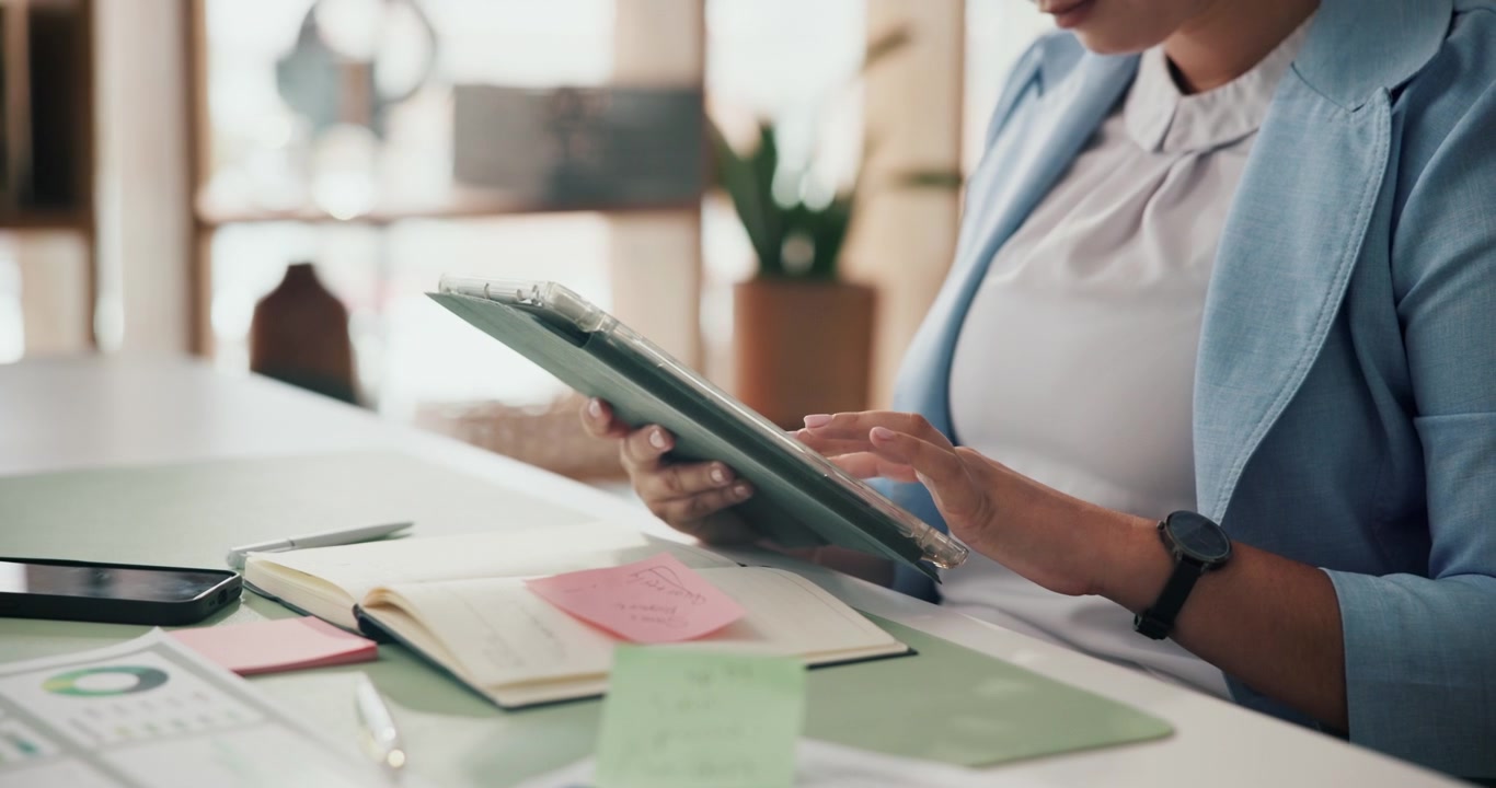 Businesswoman Using Digital Tablet at Office Desk