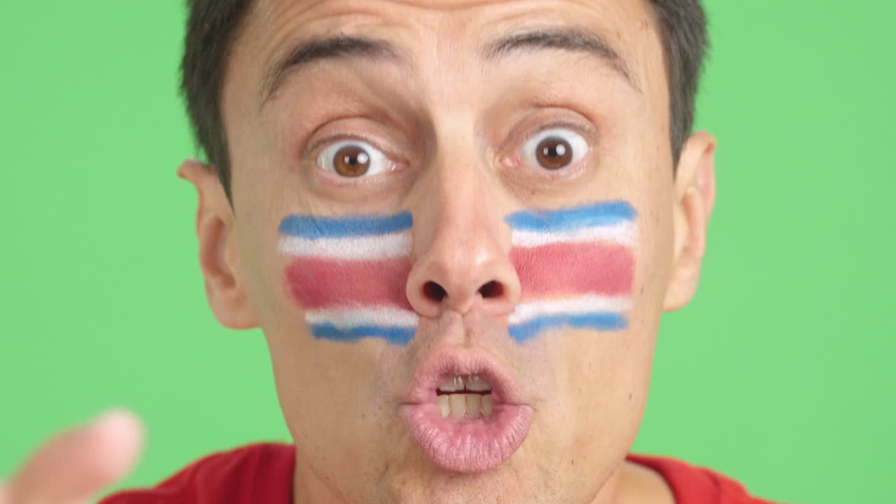 Close up of a man supporting costa rican team