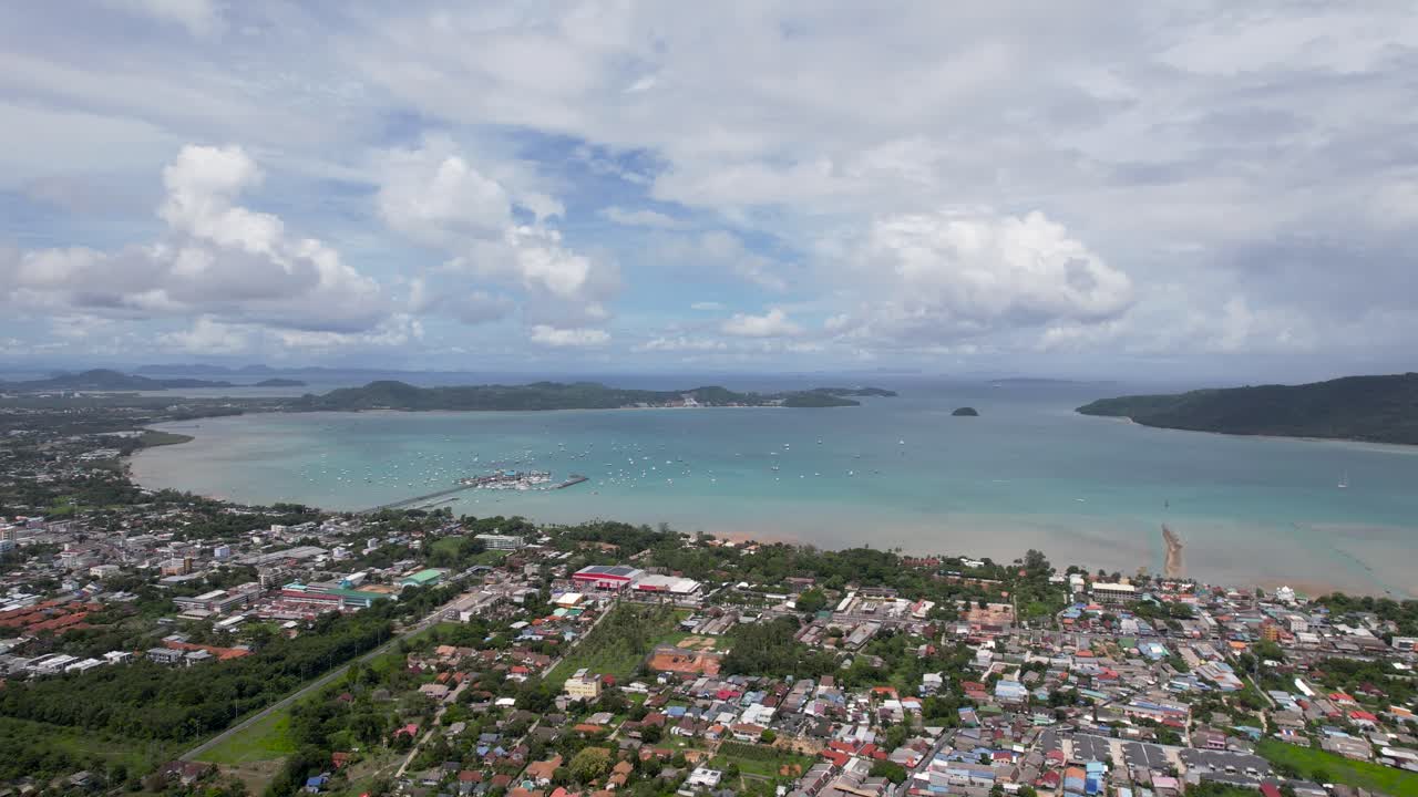 Thailand Phuket, aerial drone shot over a Rawai Mueang district on a beautiful sunny day, a turquoise lagoon facing Phi Phi island