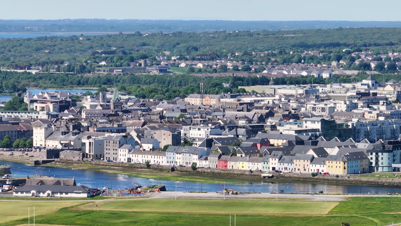 Galway city panoramic aerial cityscape with The Long Walk promenade on waterfront.